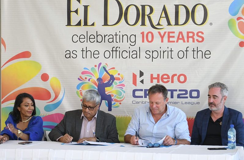 Komal Samaroo, DDL Chairman, and Pete Russell, Hero CPL's CEO sign the contract for the new partnership