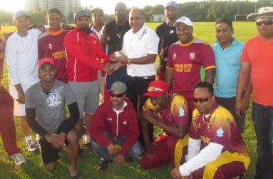 HACC president Archie Mohan hands over the signed match ball and a token of appreciation to Krishna Arjune after his brilliant innings.