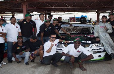 The Winning Formula! Kristian Jeffrey and his father Kevin (extreme right) and team pose for Chronicle Sport after Kristian was crowned Caribbean Champion.