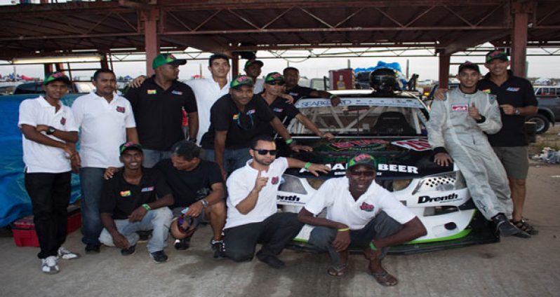 The Winning Formula! Kristian Jeffrey and his father Kevin (extreme right) and team pose for Chronicle Sport after Kristian was crowned Caribbean Champion.