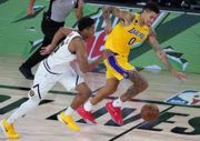 Los Angeles Lakers' Kyle Kuzma (0) tries to outrun Denver Nuggets' PJ Dozier (35) on a drive to the basket during the second half of an NBA basketball game on Monday, in Lake Buena Vista, Fla. at Advent Health Arena. (Mandatory Credit: Ashley Landis/Pool Photo-USA TODAY Sports)