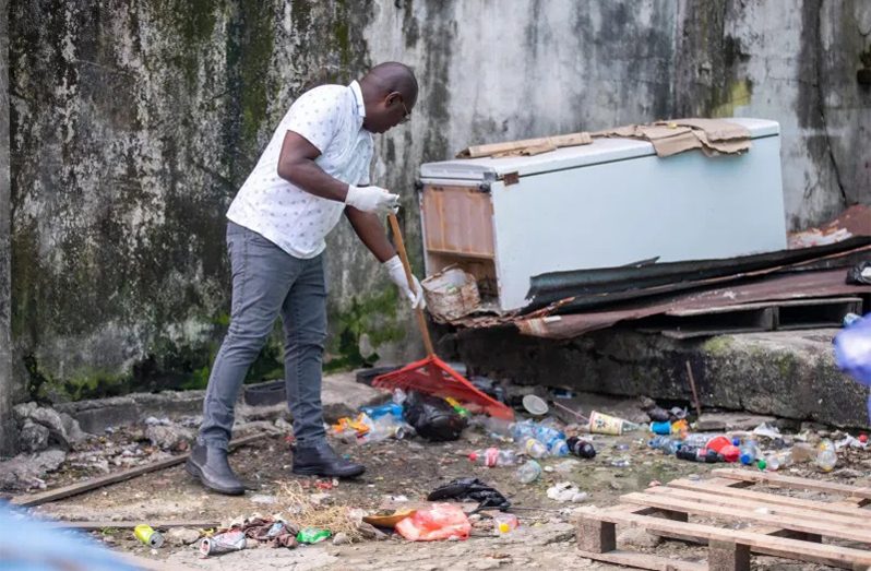 Minister McCoy taking part in the clean-up on Savage Street on Saturday