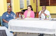 Minister with direct oversight of state media, Kwame McCoy (at right) next to GNNL’s General Manager, Moshamie Ramotar and board member, Rawle Aaron