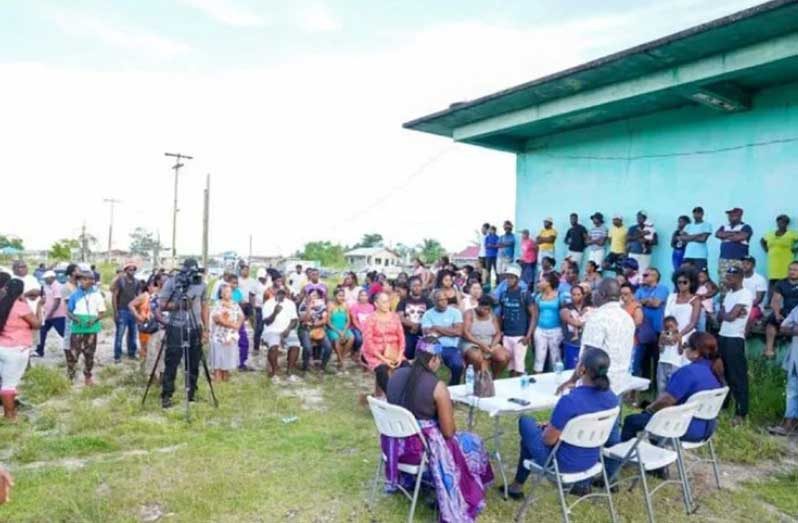 Minister within the Office of the Prime Minister with Responsibility for Public Affairs, Kwame McCoy, engages residents of Circuitville along the Soesdyke-Linden Highway and Timehri North, on the government’s highway developmental plan