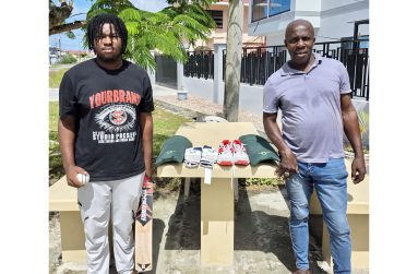 Kyle  Gibson, (left) and father Cyrus pose with the items.