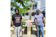 Kyle Gibson, (left) and father Cyrus pose with the items
