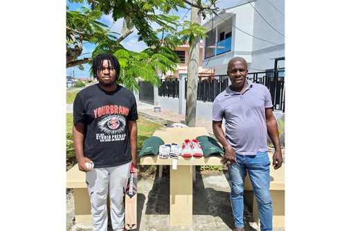 Kyle Gibson, (left) and father Cyrus pose with the items