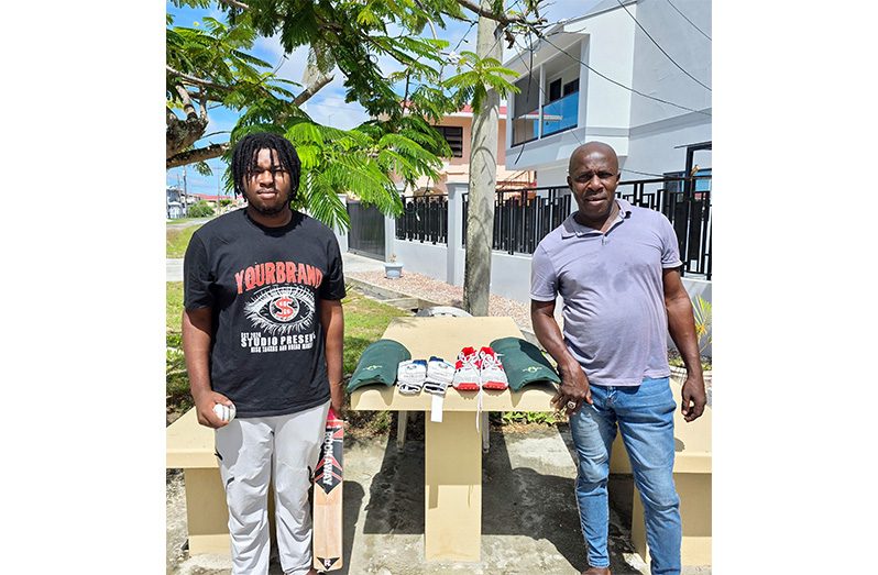 Kyle Gibson, (left) and father Cyrus pose with the items