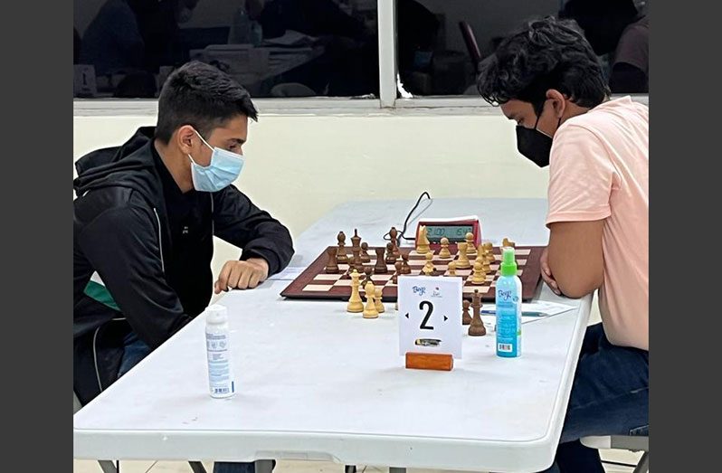 Kyle Couchman (left) and Ethan Lee battle in a four-hour game on Sunday.