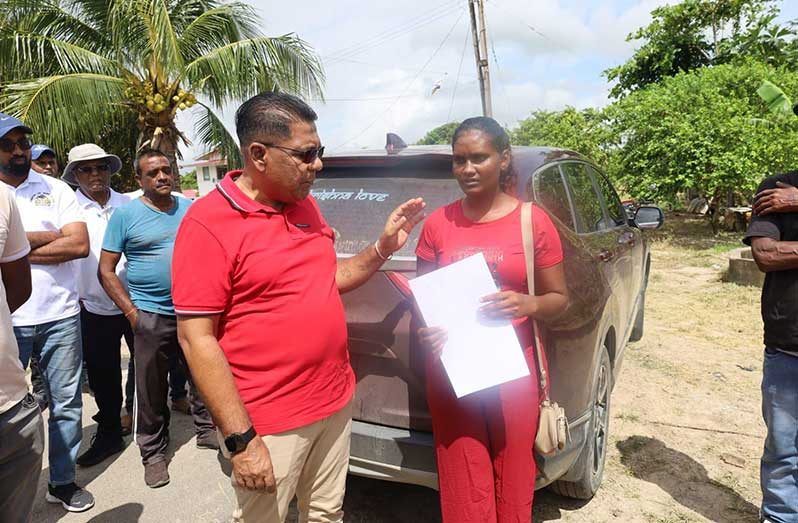 Minister Mustapha hands over the lease for the land to the Corentyne mother of four ahead of Mother’s Day, with a pledge to build her a house within two months. The woman’s husband lost his life while working out at sea