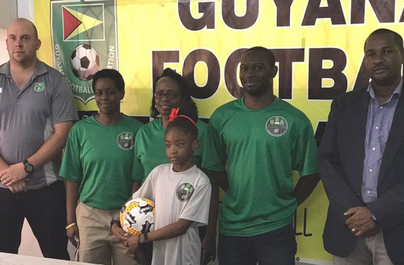 GFF president Wayne Forde (first from right) and president of the Guyana Girls Academy at the launch of the ‘Summer Girls Academy’