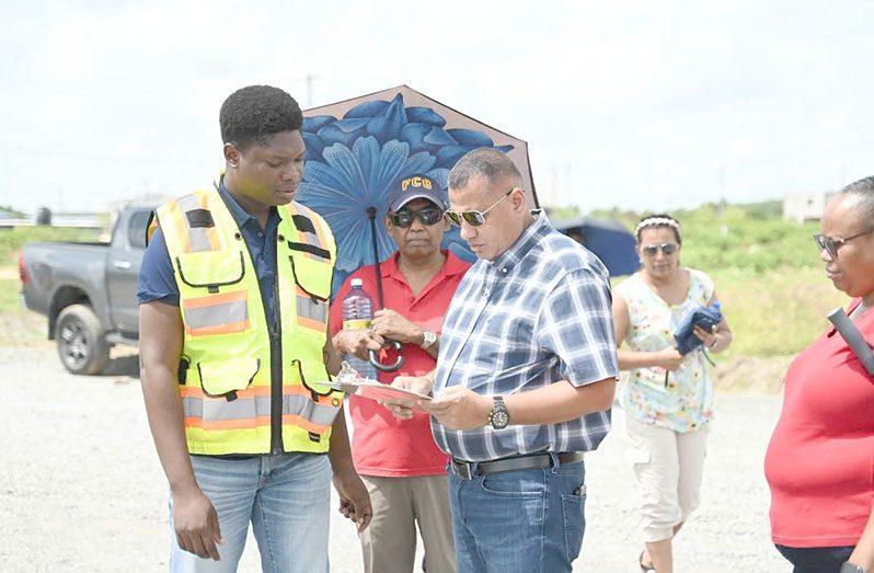 Minister of Housing, Collin Croal, inspects ongoing road rehabilitation works in the New LBI Housing Development on Saturday, where approximately $1 billion in infrastructural upgrades are underway to improve road access and connectivity within the expanding housing scheme (CH&PA photos)