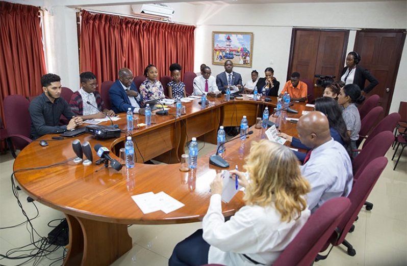 Foreign Service Institute (FSI) Director, Ambassador Ronald Austin (third left) listens to lecture series via skype along with other aspiring diplomats and diplomats (Keno George photo)