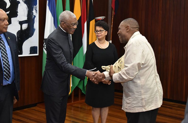 President David Granger greets High Commissioner of the Kingdom of Lesotho to Guyana, Ralechate Lincoln Mokose, in the presence of Minister of Natural Resources, Raphael Trotman (left) (Ministry of the Presidency photo)