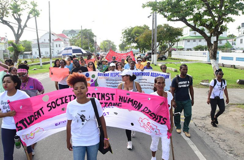 President and Co-founder of the Student Society against Human Rights Violation, Akola Thompson, leading the march on Saturday
