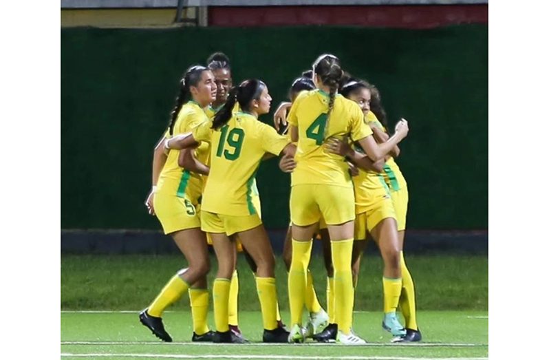 Lady Jags celebrate their win versus Antigua & Barbuda last Sunday in Suriname.