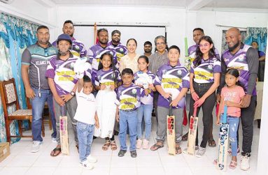 First Lady, Mrs. Arya Ali, poses for a photo with the Reliance Hustlers Sports Club from the Essequibo Coast and the cricket sports gear