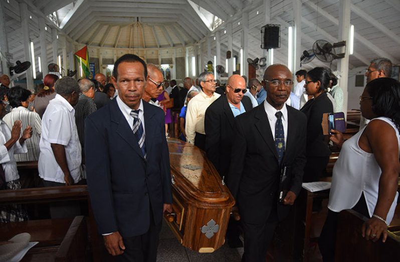 The body of Patrick Carl Holder is brought out of the St James the Less  Anglican church after his funeral service yesterday (Samuel Maughn photo)