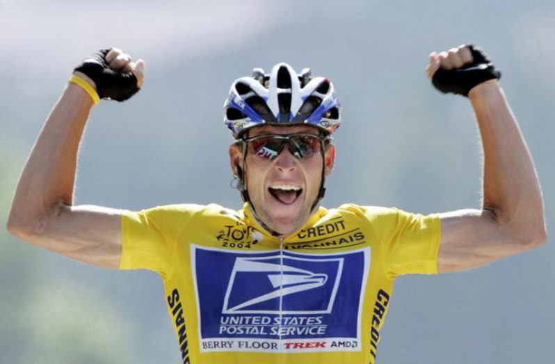 U.S. Postal Service Team rider Lance Armstrong of the United States raises his arms as he crosses the finish line to win the 204.5 km long 17th stage of the Tour de France from Bourd-d'Oisans to Le Grand Bornand, France, July 22, 2004. (REUTERS/Wolfgang Rattay/File photo)