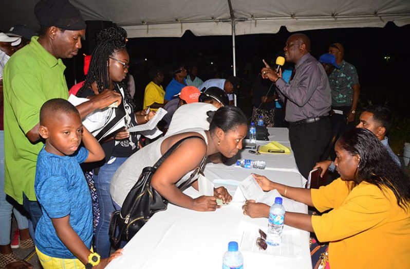 Residents of Sophia giving their letters of acknowledgement to Minster Adams-Yearwood and her team (Adrian Narine photo)