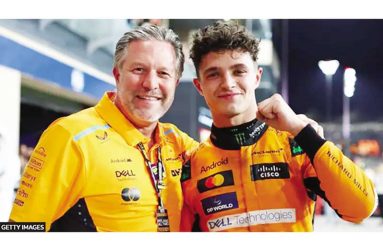 Lando Norris (right) celebrates winning the Abu Dhabi Grand Prix and the constructors' title with McLaren CEO Zak Brown (Getty Images)