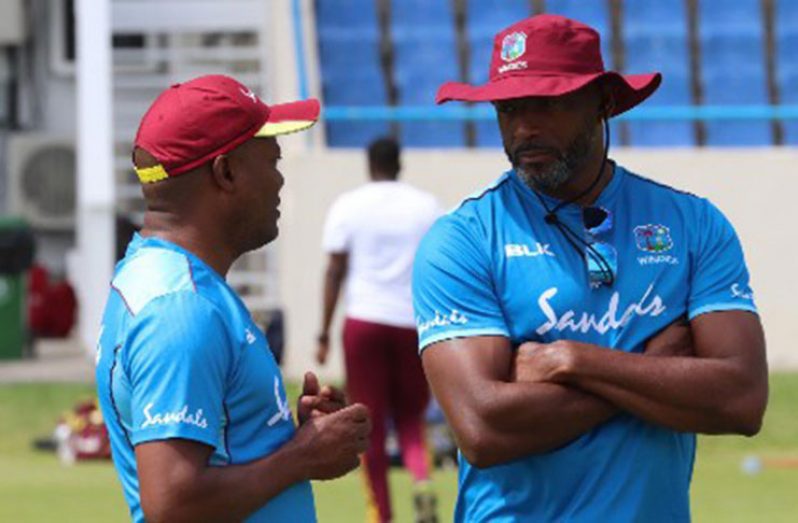 Batting legend Brian Lara chats with interim West Indies head coach Floyd Reifer during the ongoing camp.