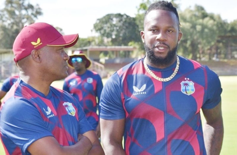 Brian Lara (left) in discussion with Kyle Mayers