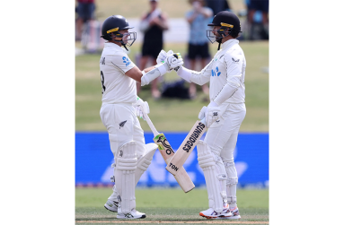 Tom Latham and Devon Conway put up a double-century stand•Dec 18, 2025•AFP/Getty Images