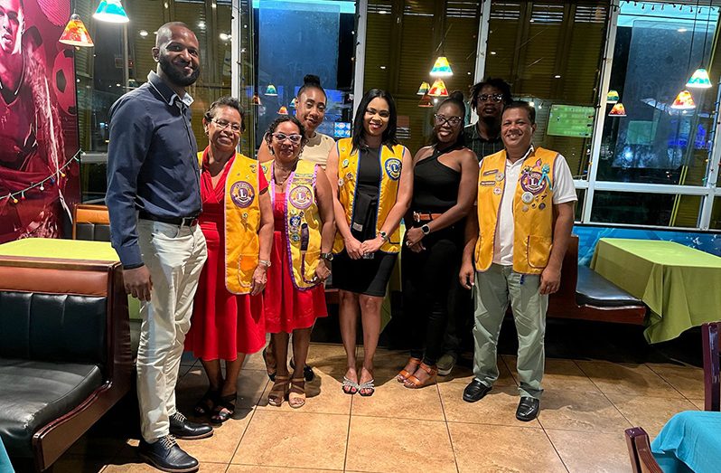 President of the Georgetown Stabroek Lions Club, Latoya Pereira (fourth from left), along with other members of the club