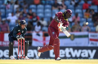 Chris Gayle launches a six. (Associated Press)