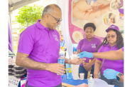 Launch Minister of Health, Dr. Frank Anthony, taking the pills to eliminate lymphatic filariasis in Guyana (Japheth Savory photos)