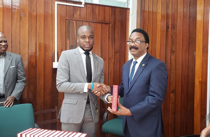Best graduating student, Micheal Munroe and Minister of Legal Affairs, Basil Williams