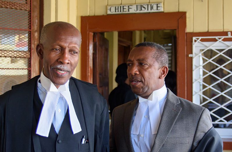 Barbadian Attorneys Hal Gallop, Q.C. and Ralph Thorne, Q.C. on Friday after Friday’s hearing at the High Court (Samuel Maughn)