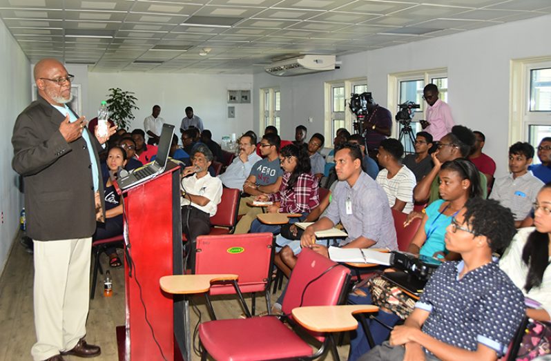 Senior instructor on Petroleum Engineering at the University of Trinidad and Tobago Lugard Layne makes a point to students and other stakeholders at the University of Guyana Wednesday (Adrian Narine)