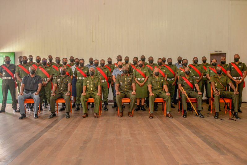 Inspector-General, Colonel Kenlloyd Roberts (centre front) flanked on his left by Commanding Officer Training Corps, Lieutenant Colonel Collin Henry and on his right by Officer Commanding SLC, Major Andre Cush, along with staff and students of SLC 10