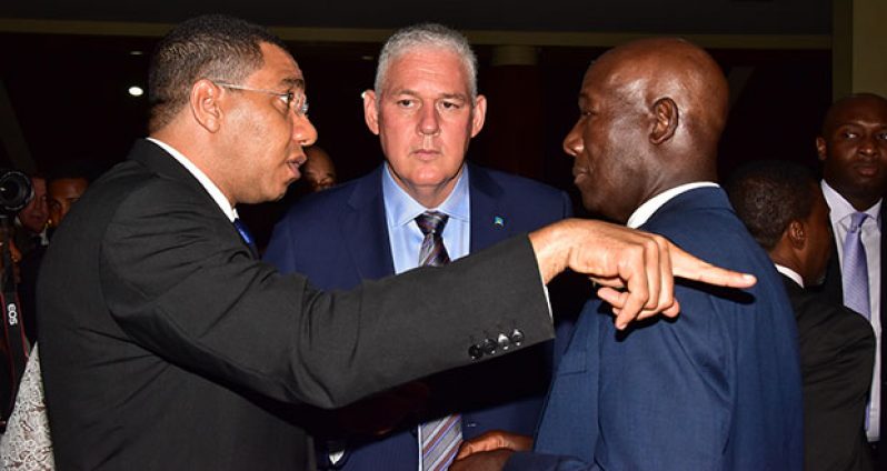 IMMIGRATION CHAT? Jamaican Prime Minister Andrew Holness, St Lucian Prime Minister Allen Chastanet, and Prime Minister of Trinidad, Dr Keith Rowley, in discussion after the opening ceremony of the 37th Meeting of the Conference of Heads of Government of CARICOM, Monday evening (Adrian Narine photo)