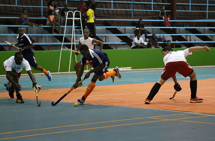 Bounty GCC's Daniel Hooper weaves through the Old Fort defence during this year’s LUCOZADE indoor hockey league