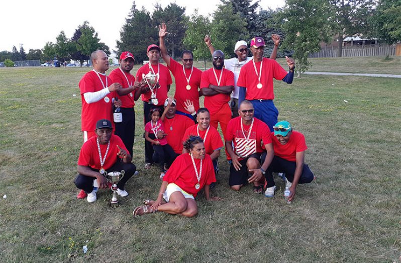 The victorious Demerara Legends pose with their winnings.