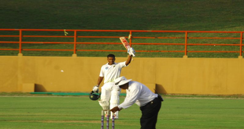 Leon Johnson acknowledges his teammates and small gathering of spectators after reaching his third first-class century