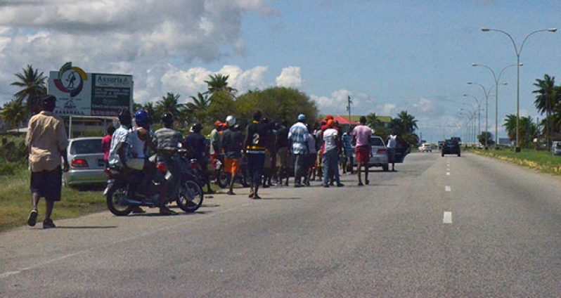 Persons who usually gather along the East Coast highway to witness the drag races