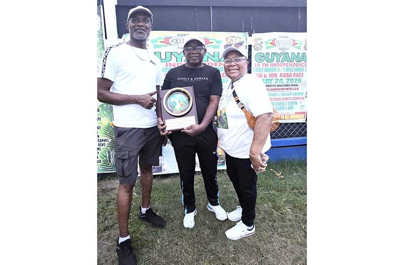 Guyana’s 60th Independence Lifetime Achievement Awardee Leslie Black is flanked by Stanley Springer (left) and Veronica Franklin