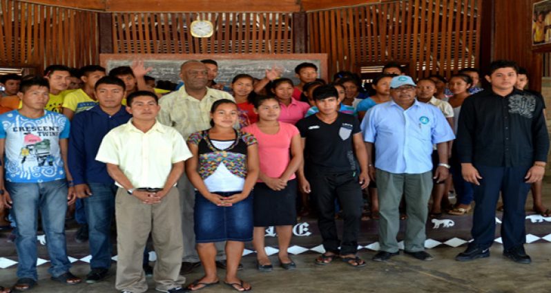 Minister of State Joseph Harmon with residents of Bina Hill, Annai in North Rupununi
