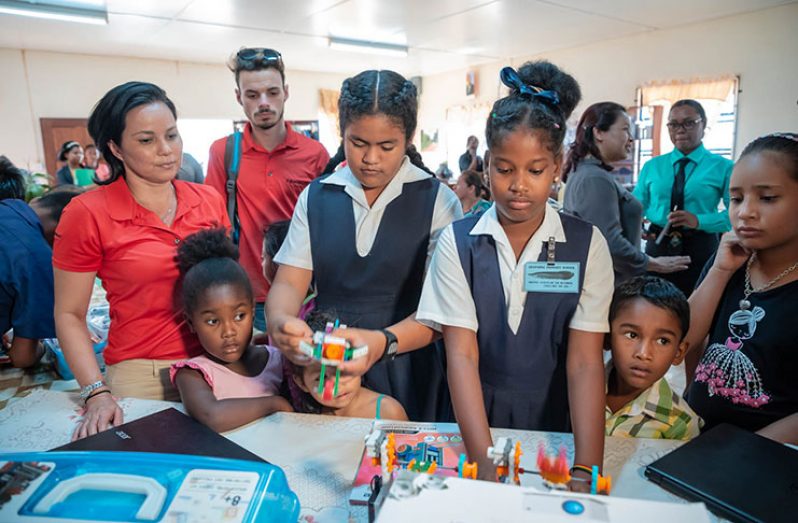 Children interacting with the equipment at the Lethem Library
