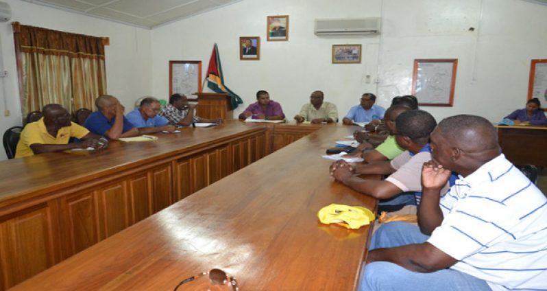 Minister of State, Joseph Harmon in discussion with regional officials at the administrative office in Lethem (Photo courtesy Ministry of the Presidency)