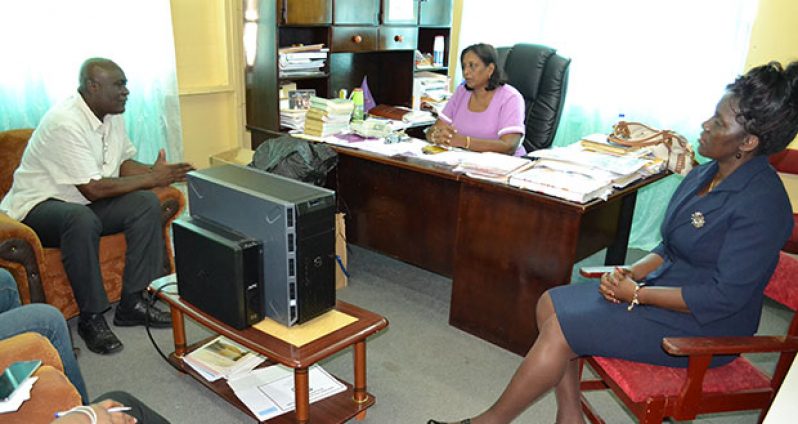Chief Executive Officer of the eGovernment Agency, Mr. Floyd Levi meets with the Regional Education Officer, Mrs. Baramdai Seepersaud (centre) to discuss the progress of the Secondary Schools Connectivity Project, which is part of the IDEAL programme