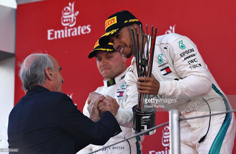 Race winner Lewis Hamilton of Great Britain and Mercedes GP is presented with his trophy on the podium during the Spanish Formula One Grand Prix at Circuit de Catalunya on May 13, 2018 in Montmelo, Spain. (Photo by David Ramos/Getty Images)