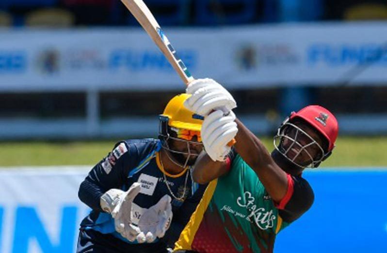 Left-hander Evin Lewis hits out en route to his top score of 89.
