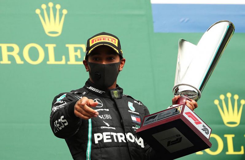 Formula One F1 - Belgian Grand Prix - Spa-Francorchamps, Spa, Belgium - Mercedes' Lewis Hamilton celebrates with the trophy on the podium after winning the race Pool via REUTERS/Francisco Seco