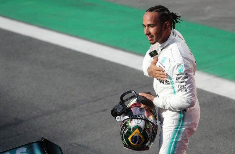 Mercedes' Lewis Hamilton celebrates after finishing in third place in qualifying. (REUTERS/Amanda Perobelli/Pool)