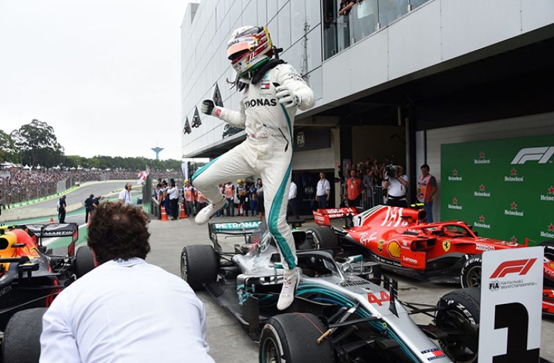 Lewis Hamilton took advantage of Max Verstappen's collision with Esteban Ocon to take victory in Brazil Credit: (AFP)